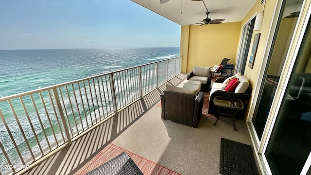 balcony featuring a water view, an outdoor living space, and ceiling fan