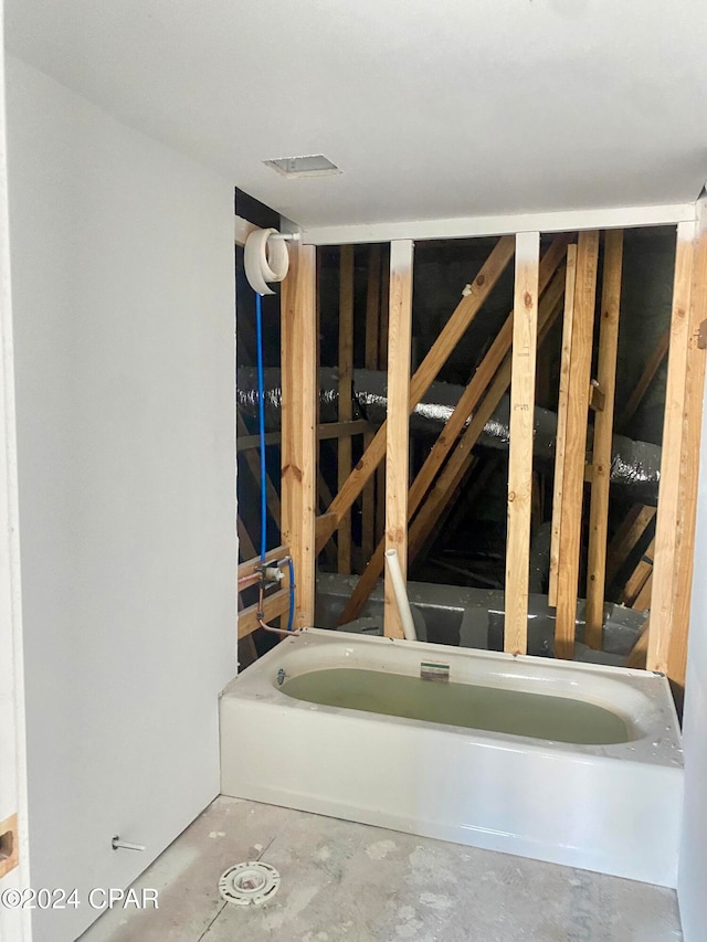 bathroom with concrete flooring