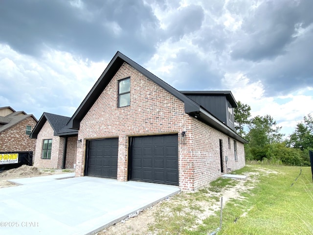 610 Shady Oaks Ln, Lynn Haven, FL 32444 - view of side of property featuring brick siding and concrete driveway