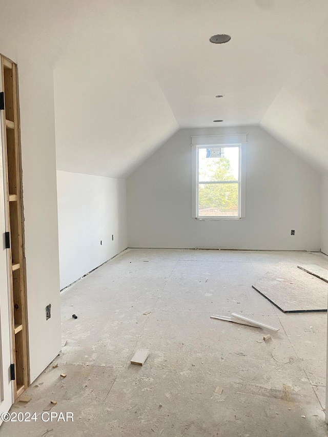 additional living space with lofted ceiling