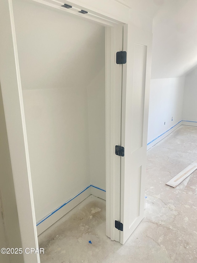 bathroom with lofted ceiling