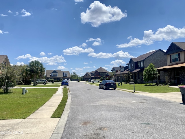610 Shady Oaks Ln, Lynn Haven, FL 32444 - view of asphalt road featuring a residential view, sidewalks, and curbs