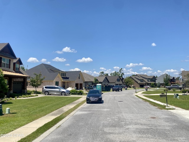 610 Shady Oaks Ln, Lynn Haven, FL 32444 - view of asphalt street featuring a residential view, sidewalks, and curbs