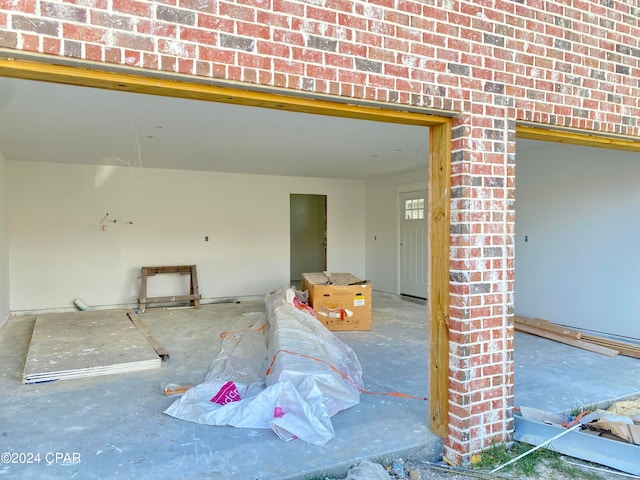 exterior space with brick wall