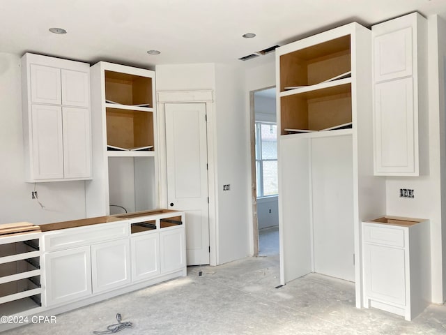 kitchen featuring white cabinetry