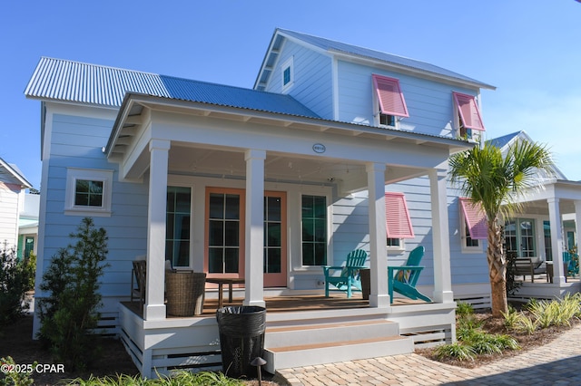 back of house featuring a porch