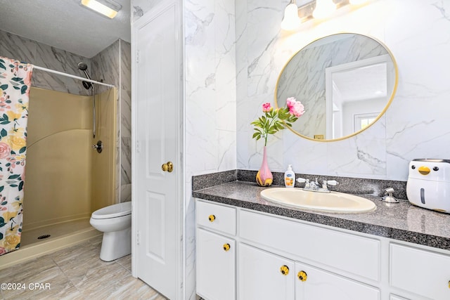 bathroom with vanity, tile patterned floors, a textured ceiling, toilet, and walk in shower