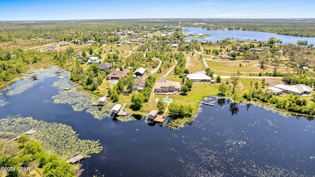 view of dock with a water view and a yard