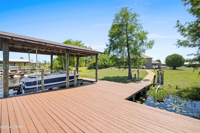 view of dock with a lawn