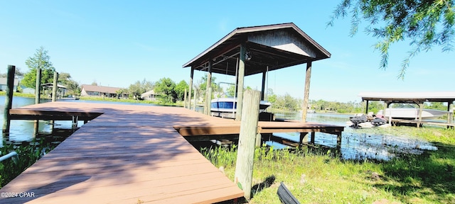 dock area with a water view