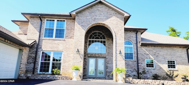 entrance to property featuring a garage