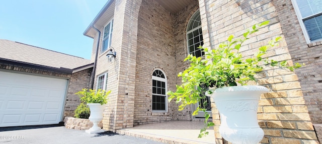 view of side of property featuring a garage