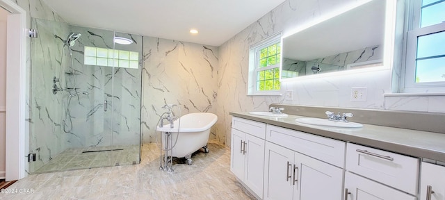 bathroom featuring tile patterned flooring, dual bowl vanity, and separate shower and tub