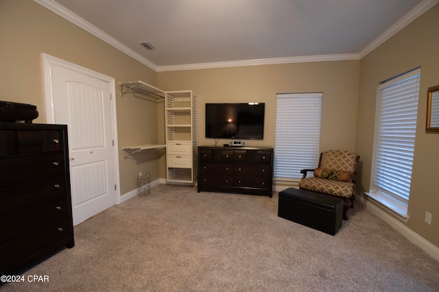 sitting room with light colored carpet and crown molding