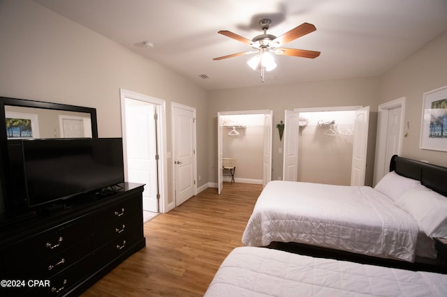 bedroom with ceiling fan and light hardwood / wood-style floors