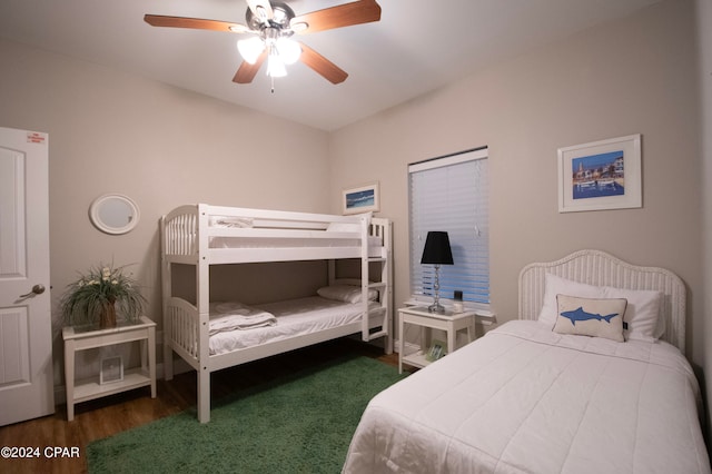 bedroom featuring dark wood-type flooring and ceiling fan