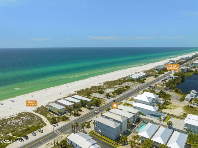 aerial view with a water view and a view of the beach