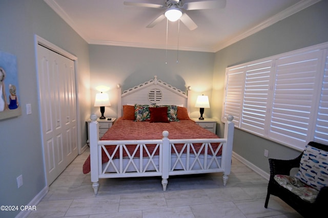 bedroom with a closet, crown molding, and ceiling fan