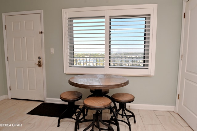 dining area with light tile patterned floors