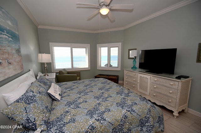 bedroom featuring ceiling fan and ornamental molding