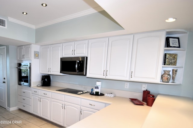 kitchen with light tile patterned flooring, crown molding, white cabinetry, and stainless steel appliances