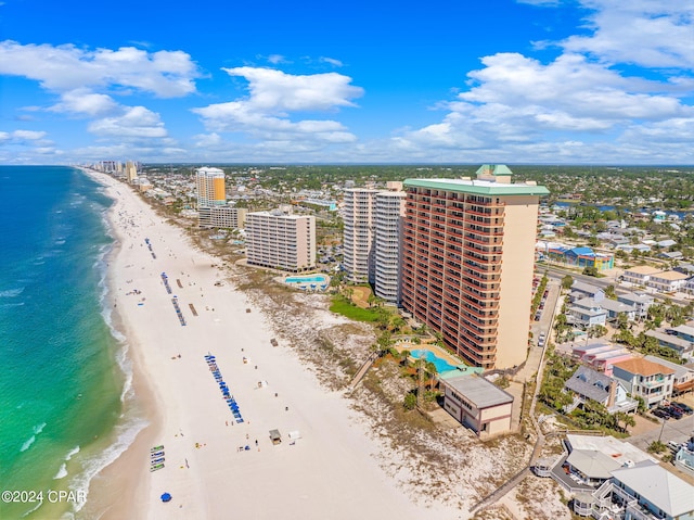 drone / aerial view with a beach view and a water view