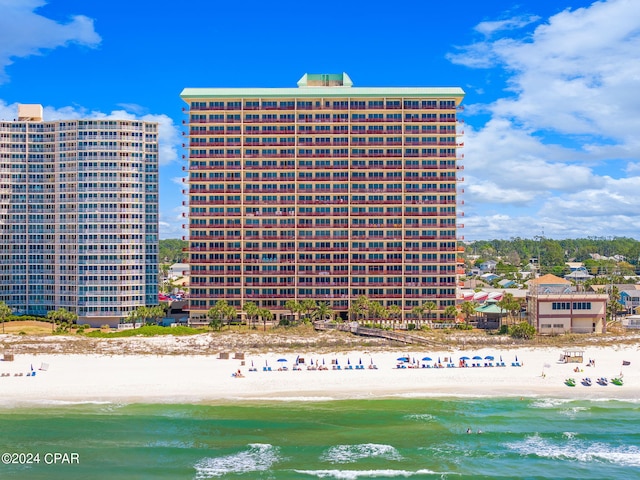 exterior space featuring a view of the beach and a water view