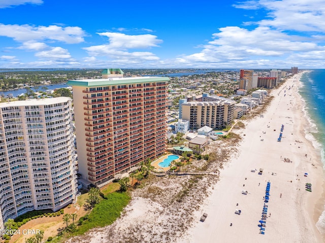 bird's eye view featuring a water view and a view of the beach