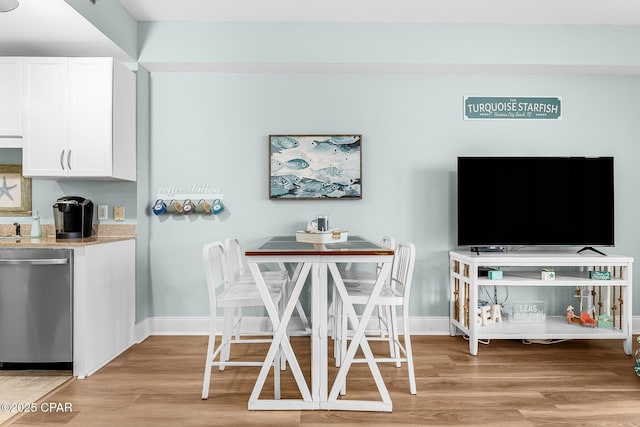 dining area with light hardwood / wood-style floors