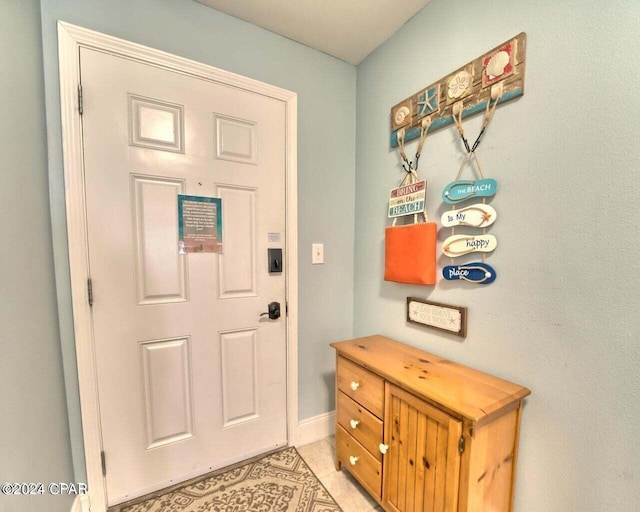 entryway with light tile patterned floors