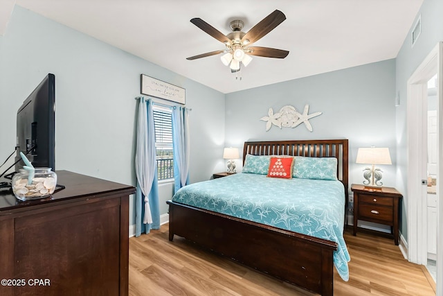 bedroom with ceiling fan and light hardwood / wood-style flooring