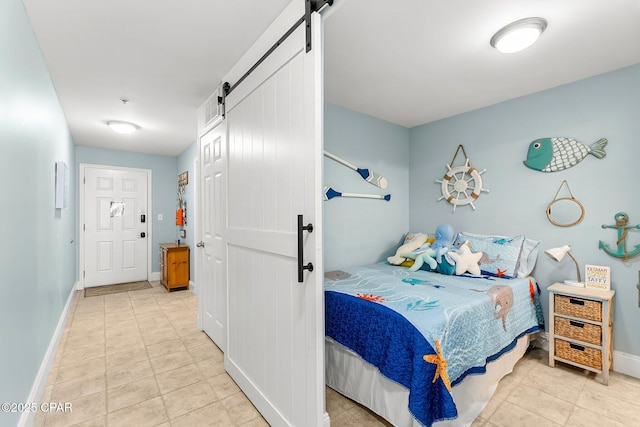 tiled bedroom with a barn door