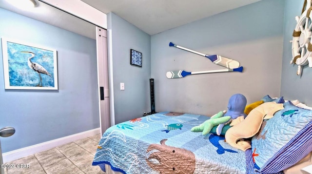 bedroom with light tile patterned floors