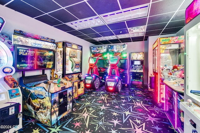 game room featuring a paneled ceiling