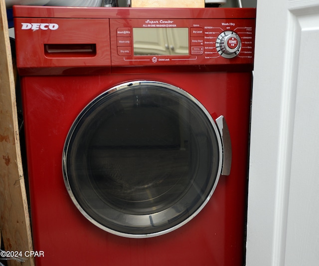 clothes washing area with washer / clothes dryer