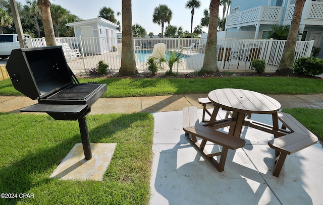 view of patio with a community pool