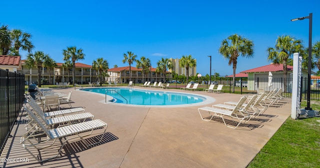 view of swimming pool with a patio