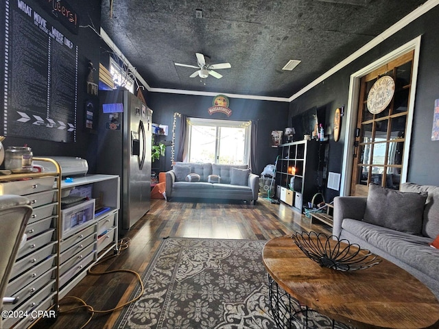 living room with crown molding, hardwood / wood-style floors, and ceiling fan