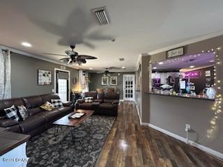 interior space with ceiling fan and dark hardwood / wood-style floors