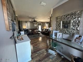 interior space featuring dark wood-type flooring and ceiling fan