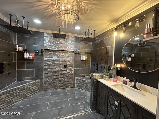 bathroom featuring an inviting chandelier, tile walls, vanity, and ornamental molding