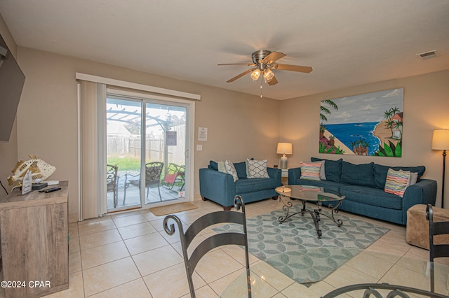 living room with ceiling fan and light tile floors