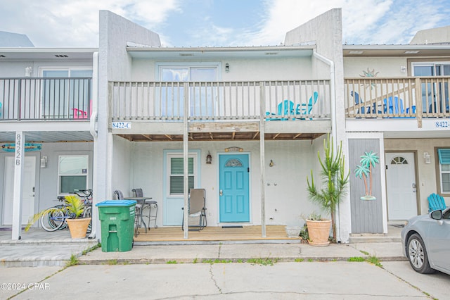 view of front of home with a balcony