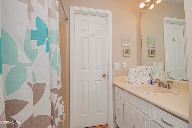 bathroom with vanity with extensive cabinet space