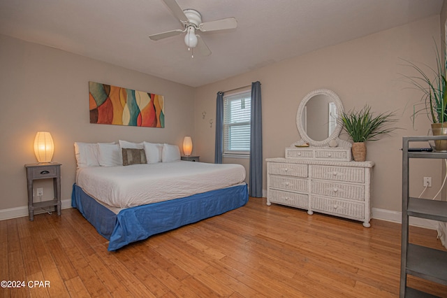 bedroom featuring ceiling fan and hardwood / wood-style floors