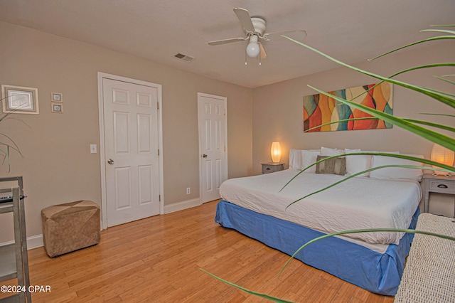 bedroom featuring ceiling fan and hardwood / wood-style flooring