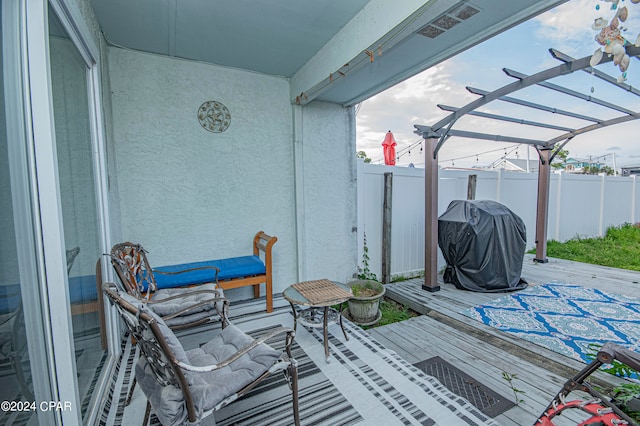 exterior space featuring a deck, a grill, and a pergola