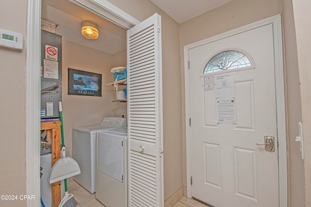 washroom with light tile flooring and separate washer and dryer