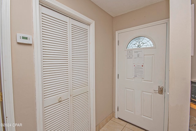 entryway with light tile flooring