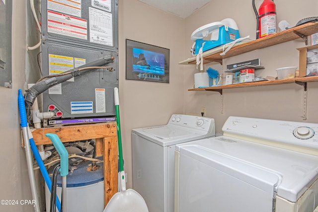 laundry area featuring washing machine and clothes dryer